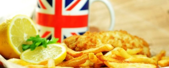 A selection of traditional English dishes including fish and chips, sausages and a Sunday roast