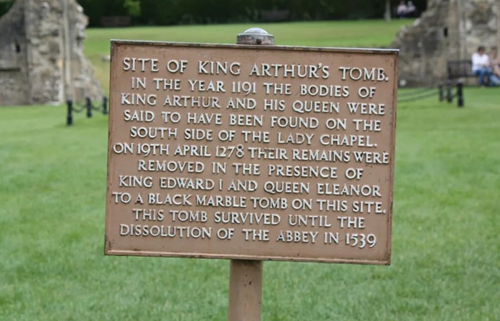 sign with words that point to the tomb of king arthur and guinevere