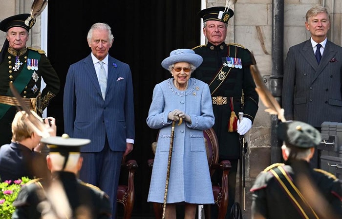 the late Queen Elizabeth II with the new King, Charles III