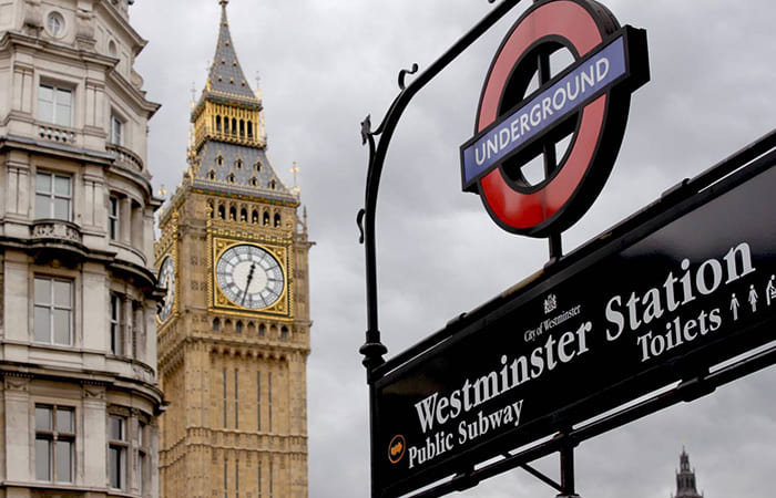 westminster station sign for entrance to the tube