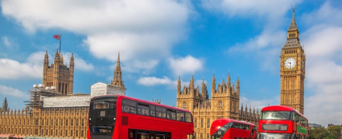 the london double-decker bus next to the houses of parliament and big ben