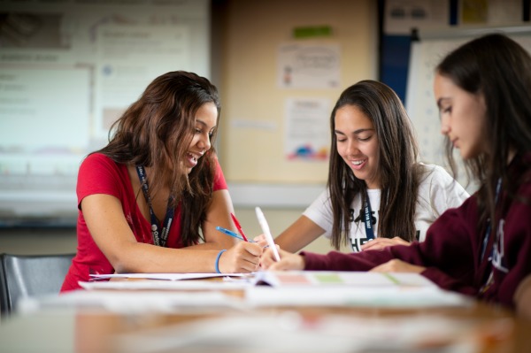 young students learning in a classroom