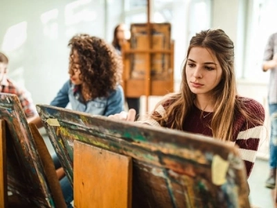 teenagers painting in a workshop