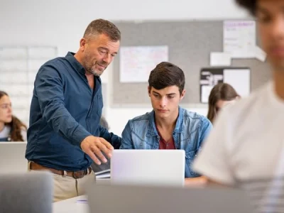 teacher helping student