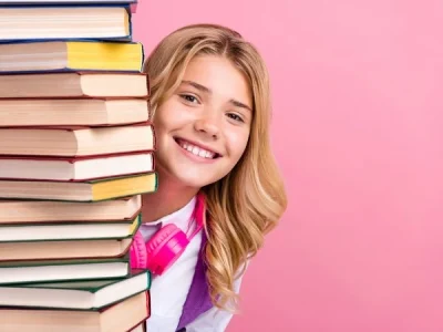 Student behind books