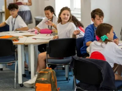 young children in a classroom doing work
